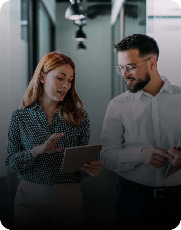 Two colleagues discussing with a tablet.
